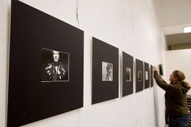 row of photos on gallery wall