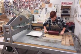student using a press