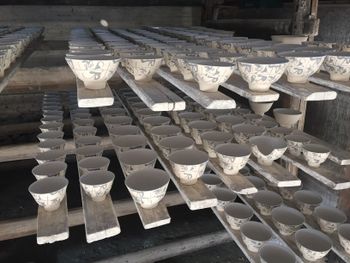 Racks of ceramic bowls drying