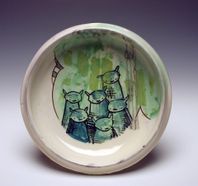 ceramic plate with cartoon bears painted on it