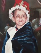young smiling boy dressed as a king